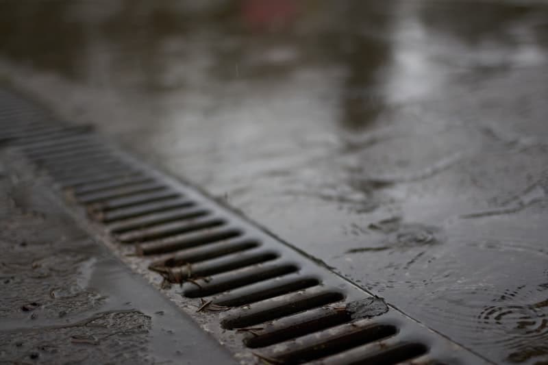 Plumber performing professional drain cleaning